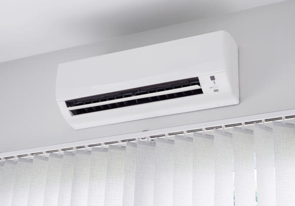 White air conditioning unit mounted on the wall.