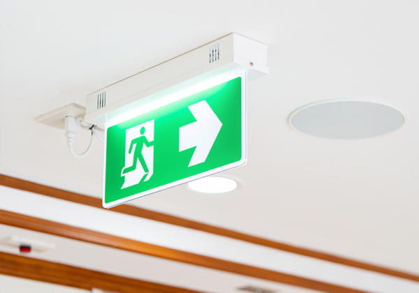 Emergency exit light signage on the ceiling.